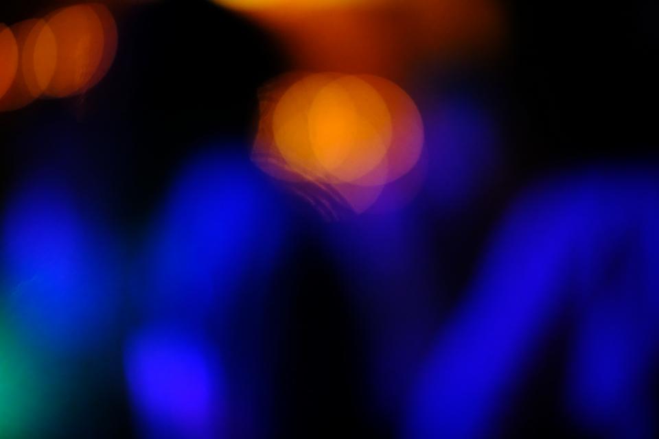 people dancing in a blurry light